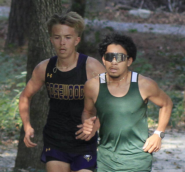 130991654_web1_LuisGageXC
Rosewoods Gage Lewis, left, attempts to match North Duplin senior Luis Aviles step for step as they complete the opening loop during the 2024 Carolina 1A Cross Country Championship meet Tuesday afternoon at Cliffs of the Neuse State Park. (Rudy Coggins|mountolivetribune.com)