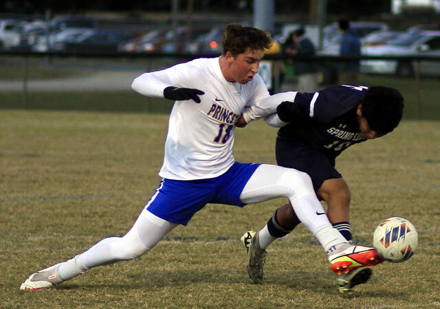 130996452_web1_GatorsDawgsBSOC
Princetons Josh Coley, left, challenges Spring Creeks Homar Lopez Castro for possession during first-half action Thursday evening in The Swamp. (Rudy Coggins|mountolivetribune.com)
