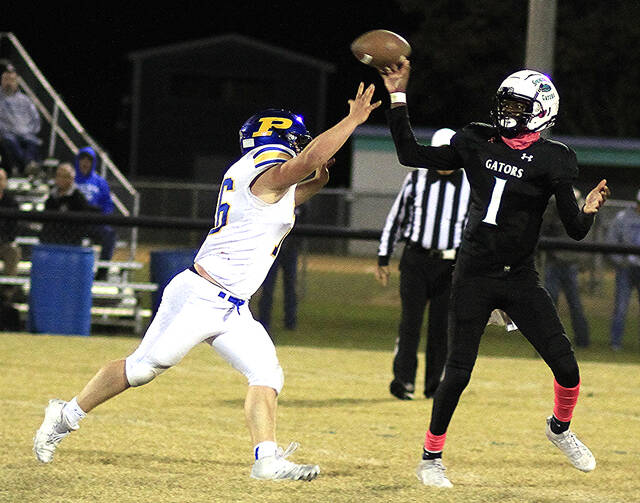 131000141_web1_CreekDJ
Spring Creek quarterback Darius DJ Deal throws under pressure from Princetons Mason Overman during their Neuse Six 2A football encounter in The Swamp on Friday evening. (Rudy Coggins|mountolivetribune.com)