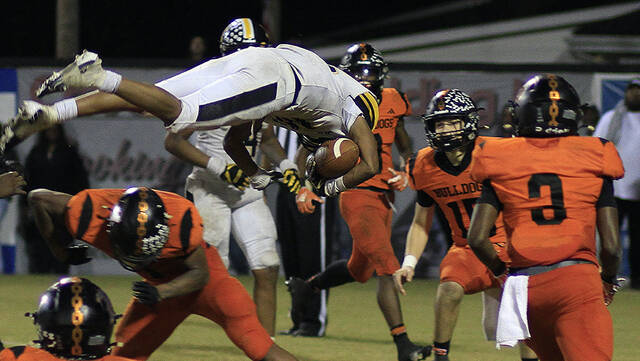 131036591_web1_Zeleya
James Kenans David Cito Zelaya goes airborne and flips his way into the end zone for a fourth-quarter touchdown against Wallace-Rose Hill on Friday evening. (Rudy Coggins|mountolivetribune.com)