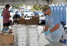 Thousands enjoy afternoon of Pickles, Pigs and Swigs to help downtown revitalization
Members of the University of Mount Olive baseball team volunteered at the barbecue sale Saturday during the fourth annual Pickles, Pigs and Swigs in downtown Mount Olive. Sponsored by the Mount Olive Area Chamber of Commerce, the N.C. Pork Council-sanctioned whole hog barbecue cook-off, benefits the Mount Olive Downtown Development Corp. (Steve Herring|mountolivetribune.com)