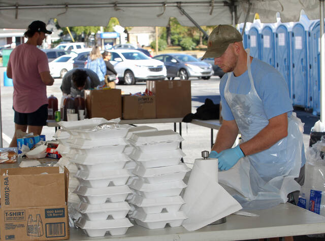 131055799_web1_Pigs-cue-1
Members of the University of Mount Olive baseball team volunteered at the barbecue sale Saturday during the fourth annual Pickles, Pigs and Swigs in downtown Mount Olive. Sponsored by the Mount Olive Area Chamber of Commerce, the N.C. Pork Council-sanctioned whole hog barbecue cook-off, benefits the Mount Olive Downtown Development Corp. (Steve Herring|mountolivetribune.com)