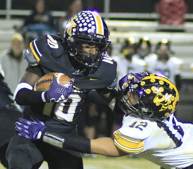 131072997_web1_JKRoRapFB1
James Kenan running back Tyquise Wilson, left, shakes off Roanoke Rapids linebacker Terrell Ham during early-game action Friday evening. (Rudy Coggins|mountolivetribune.com)