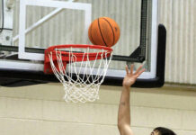 
			
				                                University of Mount Olive’s Raul Perez scores an uncontested layup while Tourran Warner from Morris College follows the play during the 59th annual Pickle Classic. (Rudy Coggins|mountolivetribune.com)
 
			
		
