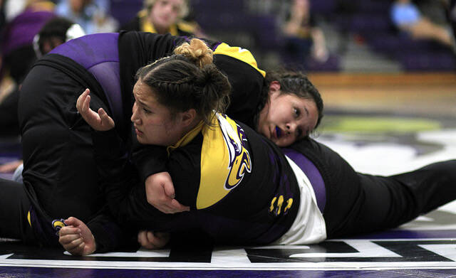 131083039_web1_UMO-Wrestler
Rosewood senior Sophia Marshall, front, warms up with her sister, AJ, before a dual-team match this season. Sophia signed an NLI to wrestle next season at the University of Mount Olive. (Rudy Coggins|mountolivetribune.com)