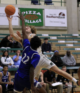 Trojans split conference hoops opener with Shorter University