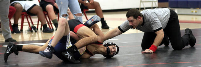 131137184_web1_SWOmar
Southern Wayne junior Omar Soler-Sanchez pins Smithfield-Selmas Hayden Cauthorne during their 113-pound match Wednesday evening. (Rudy Coggins|mountolivetribune.com)