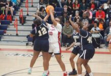 
			
				                                Lady Saint Aliyah Williams #33, works to keep possession of the ball while surrounded by a group of Lady Spartans Friday night. (Robert Taylor|mountolivetribune.com)
 
			
		