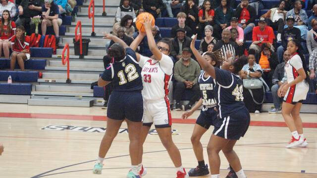 131278692_web1_Williams
Lady Saint Aliyah Williams #33, works to keep possession of the ball while surrounded by a group of Lady Spartans Friday night. (Robert Taylor|mountolivetribune.com)