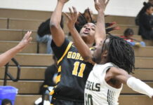 
			
				                                Anthony Kornegay gets his hand in the face of a Wildcat.
                                 Brandt Young|Sampson Independent 

			
		