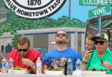 
			
				                                The popular pickle-eating contest will be back again for this year’s N.C. Pickle Festival on Saturday, April 26. Festival Co-chair Julie Beck, right, joined in on last year’s competition. (Steve Herring|mountolivetribune.com)
 
			
		