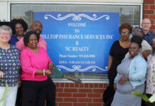
			
				                                Patricia McCoy Hill cuts the ribbon Tuesday morning during a ribbon-cutting ceremony at the new downtown location for her Hilltop Insurance Services and N.C. Realty. Behind Hill is her husband Maurice. Others include Mount Olive Area Chamber of Commerce officials Edward Olive, chairman, front row, left; Melissa Kilpatrick, immediate past chairman, front row second, from left; Julie Beck, president, front row, third from left; and far right, Leora “Sam” Jones, Chamber ambassador; and Pernell Brickley, second from right, board member. Hill purchased and rennovated the strip shopping area at 212 N. Center St.(Steve Herring|mountolivetribune.com)
 
			
		