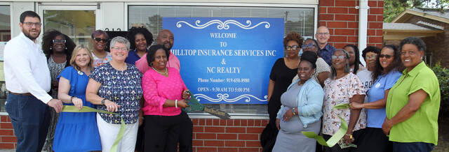 131445558_web1_Ribbon-1
Patricia McCoy Hill cuts the ribbon Tuesday morning during a ribbon-cutting ceremony at the new downtown location for her Hilltop Insurance Services and N.C. Realty. Behind Hill is her husband Maurice. Others include Mount Olive Area Chamber of Commerce officials Edward Olive, chairman, front row, left; Melissa Kilpatrick, immediate past chairman, front row second, from left; Julie Beck, president, front row, third from left; and far right, Leora Sam Jones, Chamber ambassador; and Pernell Brickley, second from right, board member. Hill purchased and rennovated the strip shopping area at 212 N. Center St.(Steve Herring|mountolivetribune.com)