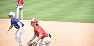 
			
				                                Austin Watson tracks down a Midway runner who grabbed a big lead off first base.
                                 Brandt Young|Sampson Independent

			
		