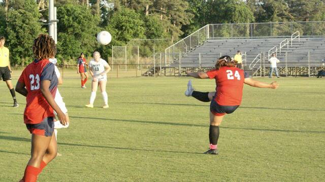 131480393_web1_southern-wayne-soccer-2
Southern Wayne defender Aracely Perez-Barrera clears the ball from midfield. (Robert Taylor|mountolivetribune.com)