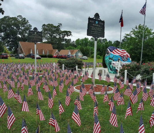 
			
				                                Hundreds of U.S. flags cover the area in front of Dudley Christian Church’s Veterans Rock for last year’s Armed Forces Day observance at the church, 212 O’Berry Rd., Dudley. The public is invited to the church fellowship hall on Saturday, May 10, for an 8 a.m. breakfast and then to help place the flags for this year’s observance that will be held at 11 a.m. Sunday, May 18, at the church. The public is invited to that event as well. (Photo courtesy Dudley Christian Church)
 
			
		