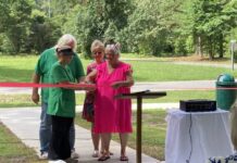 
			
				                                Joining Mayor Ronda Hughes (front, right) for the ribbon-cutting of the town’s parks are Commissioner Jackie Rouse (front, left), Commissioner Alan Hughes (back, left), and Town Clerk Patricia Jones (back, right). The ceremony took place Friday morning and was attended by approximately 40 people. (Kathy Grant Westbrook|mountolivetribune.com)
 
			
		