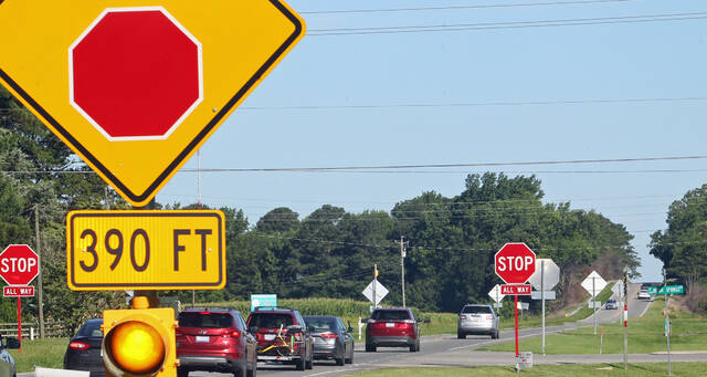 131593400_web1_Traffic-1
A sign and flashing light warn motorists traveling west on N.C. 55 toward Mount Olive that they are approaching the all-way stop at the roads intersection with Secondary Road 1744 (Old Seven Springs Road and Indian Springs Road). The N.C. Department of Transportation plans to turn the intersection into a single-lane roundabout as part of an $8 million project that includes eliminating the intersection of N.C. 55 and North Church Street. Also, North Church Street will end with a cul-de-sac, and the Old Seven Springs Road/Indian Springs Road and North Church Street intersection will be converted to an all-way stop. (Steve Herring|mountolivetribune.com)