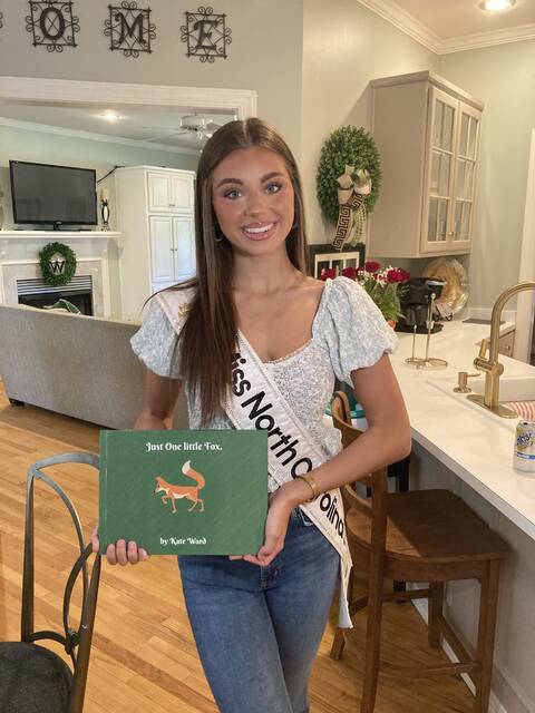 131653497_web1_IMG_3459
Miss North Carolinas Teen Kate Ward shows off a copy of her childrens book, <em>Just One Little Fox</em>. Ward wrote the book as part of her community service initiative, The Tree Hugger Project. Ward was crowned Miss North Carolinas Teen on June 28 in High Point. She will travel to Orlando, Florida, September 2-7 to compete in the Miss Americas Teen pageant. (Kathy Grant Westbrook|mountolivetribune.com)