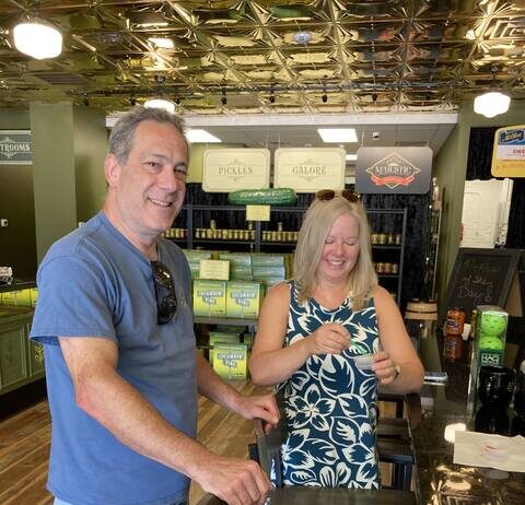 
			
				                                During their first visit to Mount Olive, Wilmington residents Reed Slatas, left, and Doran Rozen sample Mt. Olive Pickle Co. products in the company’s new downtown Pickle Parlor. Their verdict? ‘Delicious!’ and ‘Crisp and fresh!’ (Kathy Grant Westbrook|mountolivetribune.com)
 
			
		