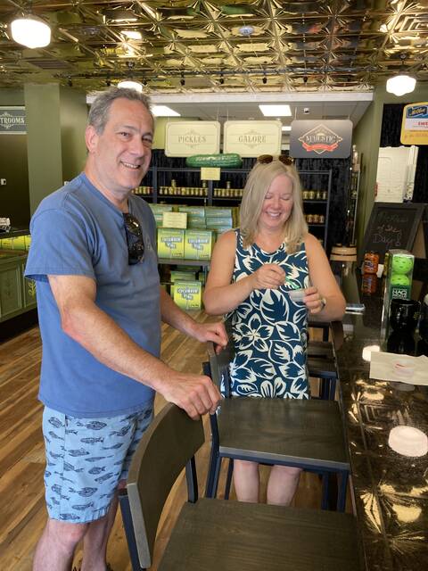 131672968_web1_pickle-parlor-1
During their first visit to Mount Olive, Wilmington residents Reed Slatas, left, and Doran Rozen sample Mt. Olive Pickle Co. products in the companys new downtown Pickle Parlor. Their verdict? Delicious! and Crisp and fresh! (Kathy Grant Westbrook|mountolivetribune.com)