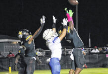 
			
				                                Raider Jayden Stox goes up looking to haul in a touchdown in the end zone against two James Kenan defenders.
 
			
		