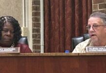 
			
				                                Interim Mount Olive Town Manager Glenn Holland, right, gives his report to the board while District 1 Commissioner Vicky Darden listens. (Georgia Martin Dees|mountolivetribune.com)
 
			
		
