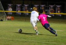 Southern Wayne Saints vs. C.B. Aycock Golden Falcons: A backyard rivalry like no other
No. 9 Skervenson Aphael battles for possession of the ball against the Golden Falcons defense. (Kareem Brown|mountolivetribune.com)