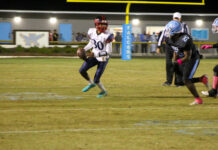 Golden Falcons soar past Saints in dominant victory, 49–8
Quarterback No. 30, Jayden Moore rolls out of the pocket, fighting to spark the Saints offense and make something happen. (Kareem Brown|mountolivetribune.com)