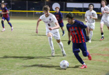 Southern Wayne Saints advance to Round 2 after 3–1 victory over Cedar Ridge
No. 25 Otoniel Aguilon shows control downfield, navigating through multiple Red Wolves defenders. (Kareem Brown|mountolivetribune.com)