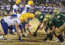 A double-overtime thriller ends in heartbreak for the Rebels
The intensity builds as the North Duplin Rebels and Edenton Holmes Aces line up for the first drive of the half. (Kareem Brown|mountolivetribune.com)