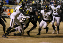 
			
				                                James Kenan’s No. 0 Taulil Pearsall, powers through the Farmville Central defense on his way to a 137-yard performance. (Kareem Brown|mountolivetribune.com)
 
			
		