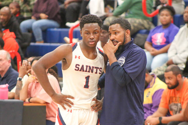Southern Waynes Coach Brian West coaching up his player on a quick timeout. (Kareem Brown|mountolivetribune.com)