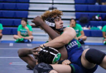 
			
				                                Spring Creek and J.H. Rose clash in a major showdown, with every move on the mat making a difference. (Kareem Brown|mountolivetribune.com)
 
			
		