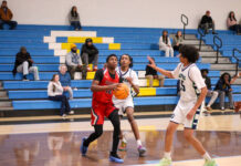 Saints’ relentless pressure overwhelms Gators in FCA Tournament matchup
Southern Waynes No. 12 Imeir Kornegay, drives to the basket while battling heavy Gators defense. (Kareem Brown|mountolivetribune.com)