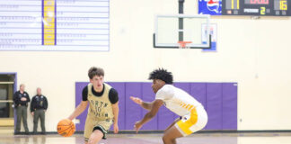 
			
				                                North Duplins No. 10 Lucas Dail drives the ball up the court against the Eagles defenders looking for an opening.
 
			
		
