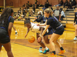 Lady Tigers roar past Midway in dominant conference victory
James Kenans No. 32 Aleyah Wilson, trying to get possession of the ball to layup the ball against the tough Lady Raiders defense.