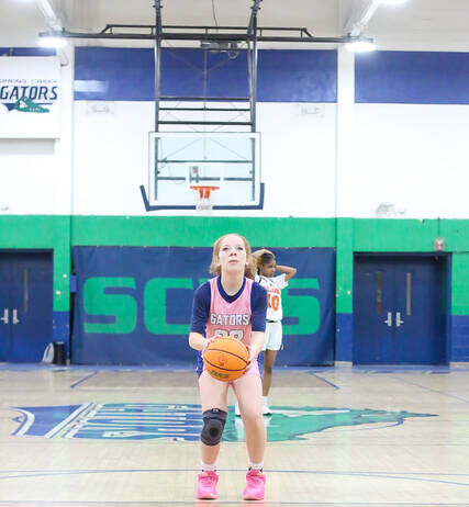 
			
				                                Spring Creeks No. 22 Nicole Jackson converts one of two attempts at the free-throw line. (Kareem Brown|mountolivetribune.com)
 
			
		