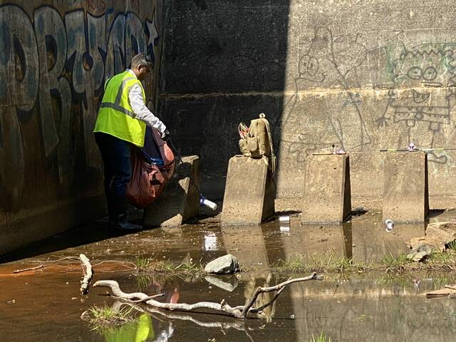 Volunteers came together for an environmental service initiative as part of a river cleanup. (Courtesy photos)