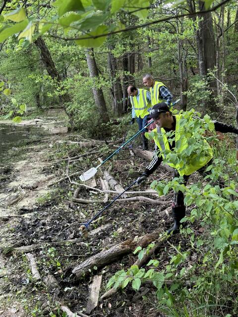 Volunteers came together for an environmental service initiative as part of a river cleanup. (Courtesy photos)