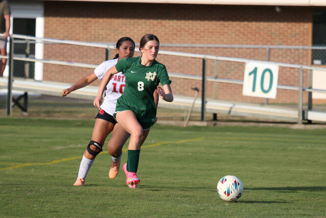 North Duplins No. 8 Carrly Strickland makes a strong move past a Union defender en route to a goal for the Lady Rebels. (Kareem Brown|mountolivetribune.com)