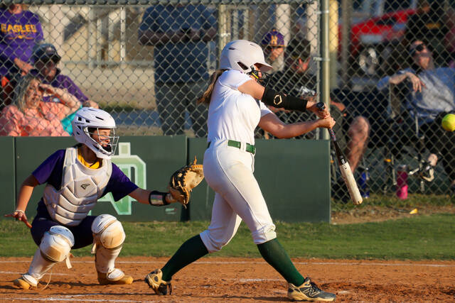 North Duplins No. 2 Gracelyn Higginbotham connects for a key base hit, advancing to first and driving in a run at home plate for the score.