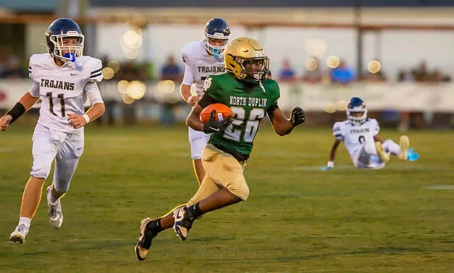 North Duplins No. 26 Damarion Smith on the return after a kick by the Trojans getting a big touchdown return.